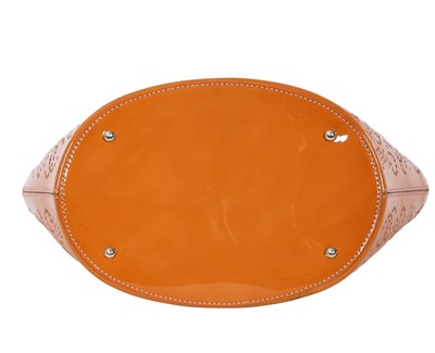 Lot 65 - A Chanel by Karl Lagerfeld punched orange patent leather tote, 2005-2006