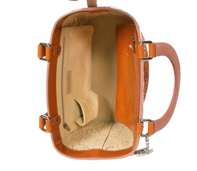 Lot 65 - A Chanel by Karl Lagerfeld punched orange patent leather tote, 2005-2006