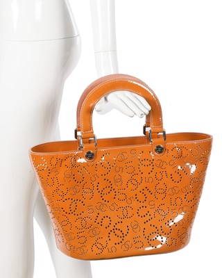 Lot 65 - A Chanel by Karl Lagerfeld punched orange patent leather tote, 2005-2006
