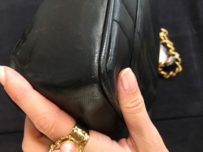 Lot 83 - A Chanel by Karl Lagerfeld jumbo black leather flap bag, 1991-94