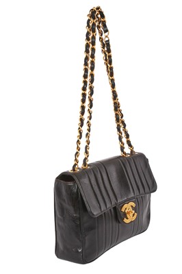 Lot 83 - A Chanel by Karl Lagerfeld jumbo black leather flap bag, 1991-94