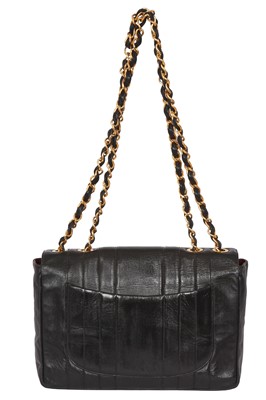 Lot 83 - A Chanel by Karl Lagerfeld jumbo black leather flap bag, 1991-94