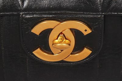 Lot 83 - A Chanel by Karl Lagerfeld jumbo black leather flap bag, 1991-94