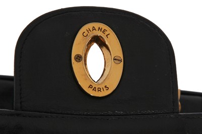 Lot 83 - A Chanel by Karl Lagerfeld jumbo black leather flap bag, 1991-94