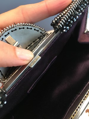 Lot 62 - A Chanel by Karl Lagerfeld purple suede evening clutch, early 2000s