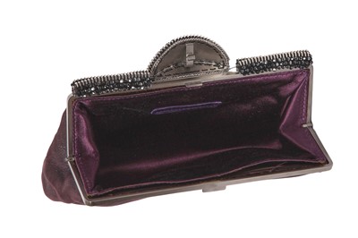 Lot 62 - A Chanel by Karl Lagerfeld purple suede evening clutch, early 2000s