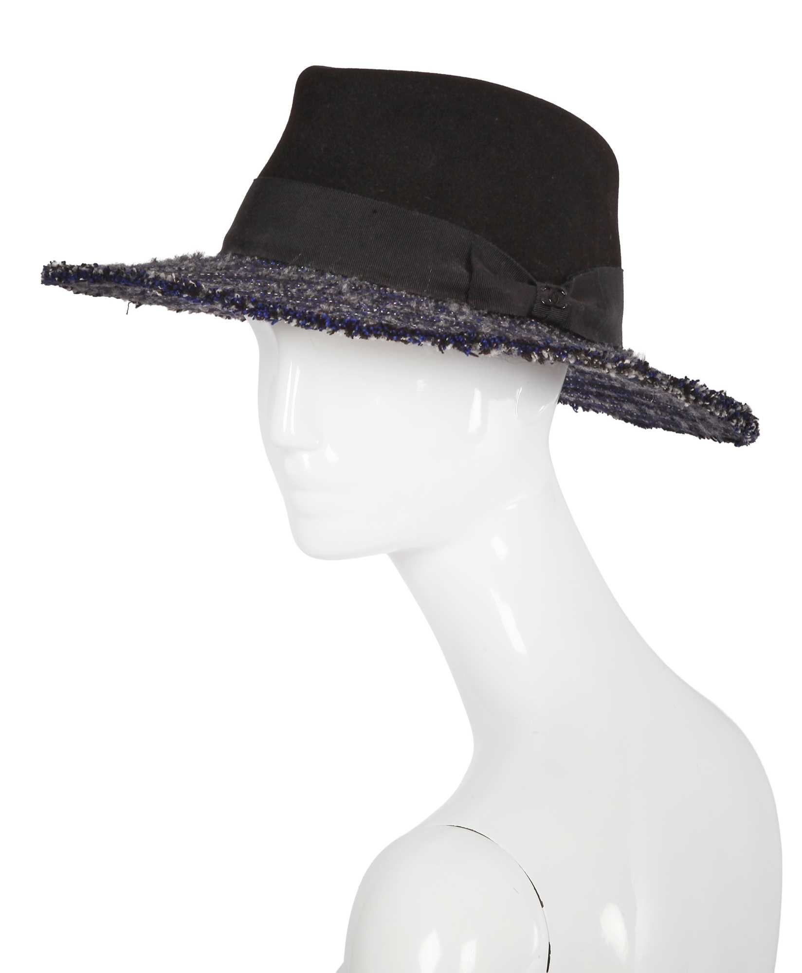 Lot 38 - A Chanel by Karl Lagerfeld blue and black tweed hat, 2010s