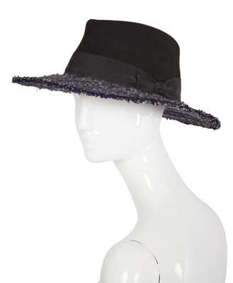 Lot 38 - A Chanel by Karl Lagerfeld blue and black tweed hat, 2010s