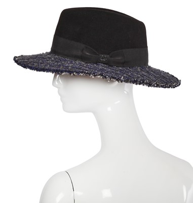 Lot 38 - A Chanel by Karl Lagerfeld blue and black tweed hat, 2010s