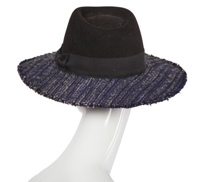 Lot 38 - A Chanel by Karl Lagerfeld blue and black tweed hat, 2010s