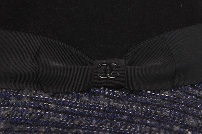 Lot 38 - A Chanel by Karl Lagerfeld blue and black tweed hat, 2010s