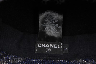 Lot 38 - A Chanel by Karl Lagerfeld blue and black tweed hat, 2010s