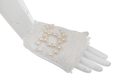 Lot 18 - A pair of Chanel haute couture by Karl Lagerfeld white tweed mitts, Spring-Summer 2014