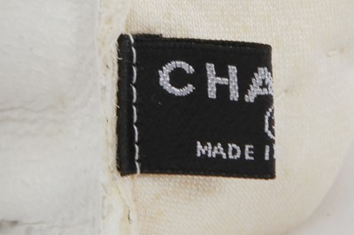 Lot 18 - A pair of Chanel haute couture by Karl Lagerfeld white tweed mitts, Spring-Summer 2014