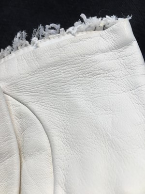 Lot 18 - A pair of Chanel haute couture by Karl Lagerfeld white tweed mitts, Spring-Summer 2014