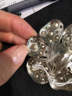 Lot 32 - A Chanel by Karl Lagerfeld rhinestone camellia brooch, 2011