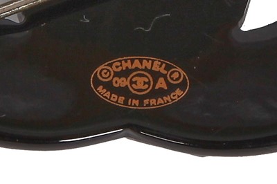 Lot 41 - A Chanel by Karl Lagerfeld 'CC' rhinestone-set brooch, 2010