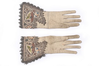 Lot 100 - A pair of men's embroidered leather gauntlet...