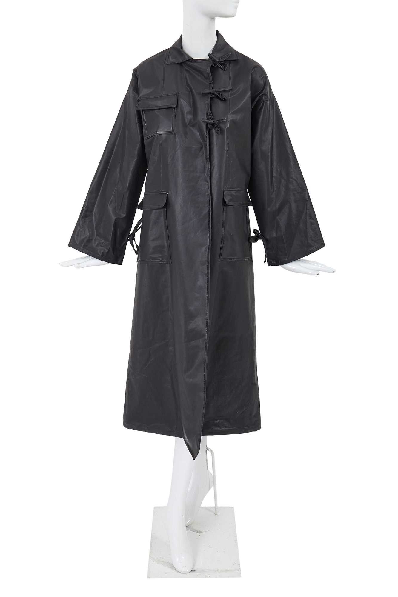 Lot 2 - A Comme des Garçons black polyurethane raincoat, 1970s