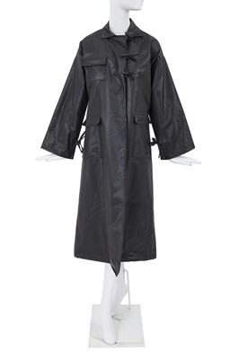 Lot 2 - A Comme des Garçons black polyurethane raincoat, 1970s