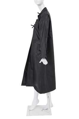 Lot 2 - A Comme des Garçons black polyurethane raincoat, 1970s