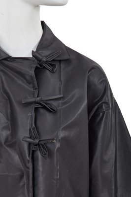 Lot 2 - A Comme des Garçons black polyurethane raincoat, 1970s
