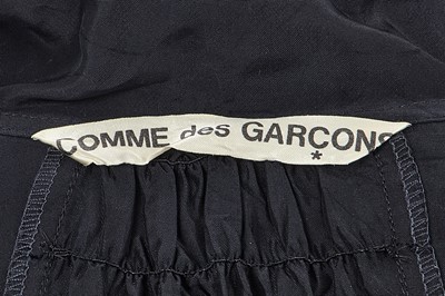 Lot 46 - A Comme des Garçons black satin smock, ‘Indigo Dye and Twist’ collection, Spring-Summer 1982