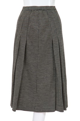 Lot 23 - A Comme des Garçons black and white knitted three-piece ensemble, circa 1980