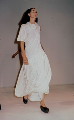 Lot 87 - A Comme des Garçons black cotton jersey dress, probably ‘Round Rubber’ collection, Spring-Summer 1984