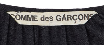 Lot 64 - A Comme des Garçons black wool dress, probably ‘Holes’ collection, Autumn-Winter 1982-83