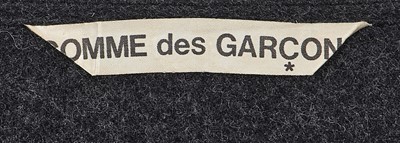 Lot 75 - A rare and important Comme des Garçons grey wool dress, ‘Gloves, Skirts, Quilted Big Coats’ collection, Autumn-Winter 1983-84