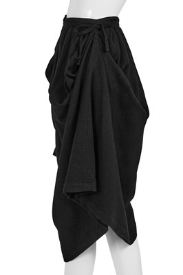 Lot 77 - A Comme des Garçons black wool ensemble, ‘Gloves, Skirts, Quilted Big Coats’ collection, Autumn-Winter 1983-84 s)’ collection, Autumn-Winter 1984-85