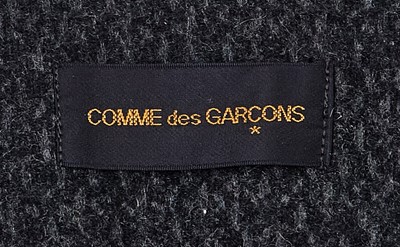 Lot 65 - A Comme des Garçons speckled grey wool jacket, ‘Holes’ collection, Autumn-Winter 1982-83