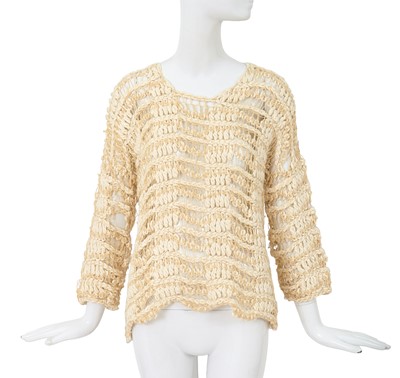 Lot 92 - A Comme des Garçons beige cotton and wool open-knit sweater, circa 1984