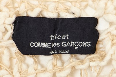 Lot 92 - A Comme des Garçons beige cotton and wool open-knit sweater, circa 1984