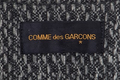 Lot 63 - A Comme des Garçons grey speckled wool jacket, ‘Holes’ collection, Autumn-Winter 1982-83