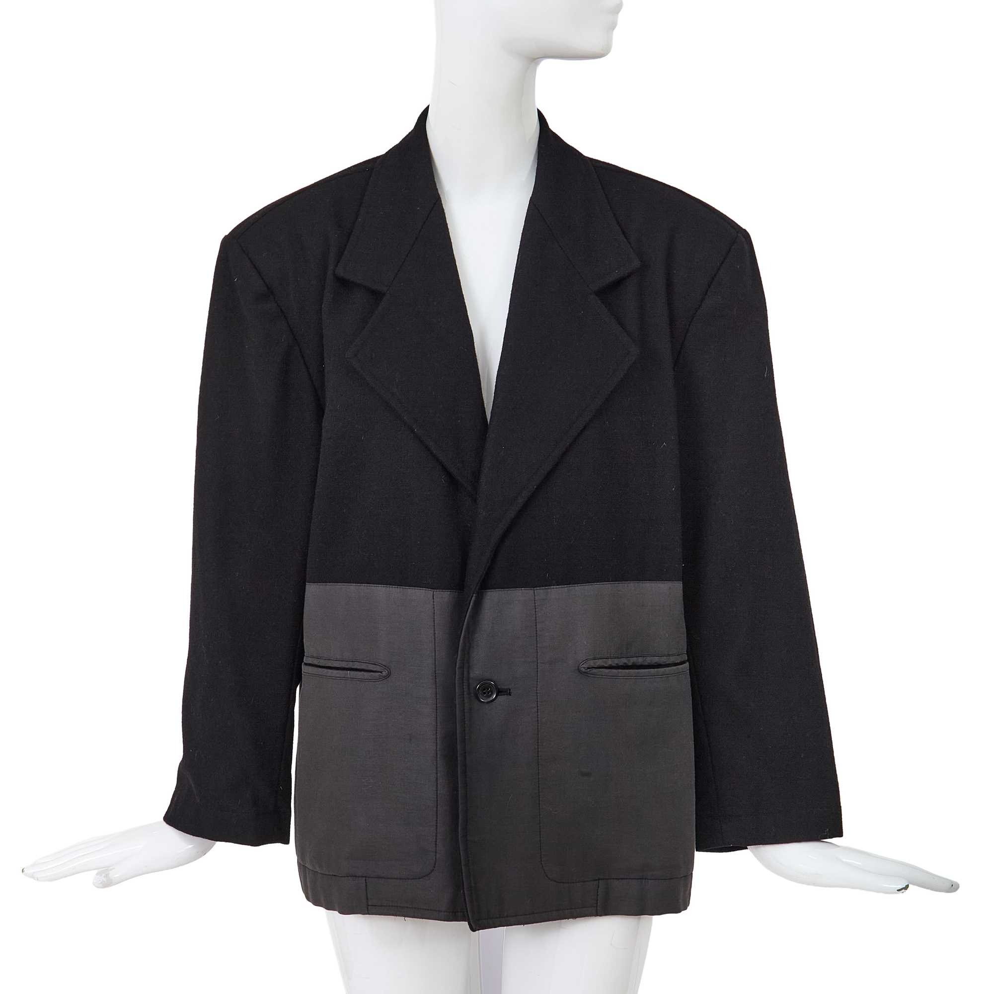 Lot 93 - A Comme des Garçons black wool and cotton blazer, probably ‘Twist, Silk + Jersey, Knits (Patchworks)’ collection, Autumn-Winter 1984-85