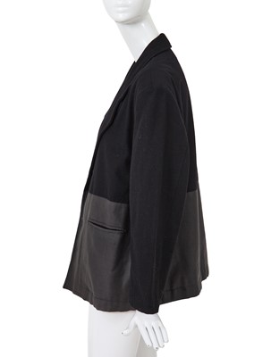 Lot 93 - A Comme des Garçons black wool and cotton blazer, probably ‘Twist, Silk + Jersey, Knits (Patchworks)’ collection, Autumn-Winter 1984-85