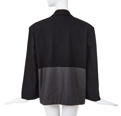 Lot 93 - A Comme des Garçons black wool and cotton blazer, probably ‘Twist, Silk + Jersey, Knits (Patchworks)’ collection, Autumn-Winter 1984-85