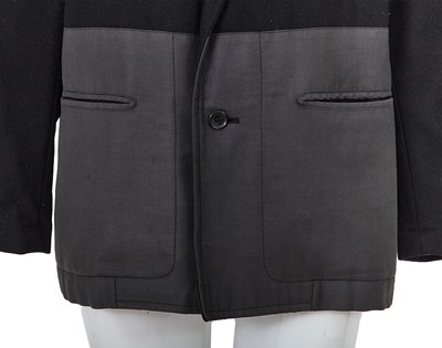 Lot 93 - A Comme des Garçons black wool and cotton blazer, probably ‘Twist, Silk + Jersey, Knits (Patchworks)’ collection, Autumn-Winter 1984-85