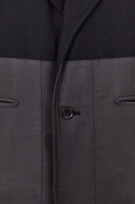 Lot 93 - A Comme des Garçons black wool and cotton blazer, probably ‘Twist, Silk + Jersey, Knits (Patchworks)’ collection, Autumn-Winter 1984-85