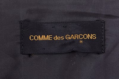 Lot 93 - A Comme des Garçons black wool and cotton blazer, probably ‘Twist, Silk + Jersey, Knits (Patchworks)’ collection, Autumn-Winter 1984-85