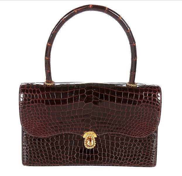 Lot 27 - An Hermès chocolate brown crocodile handbag,...