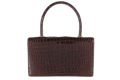 Lot 27 - An Hermès chocolate brown crocodile handbag,...