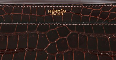Lot 27 - An Hermès chocolate brown crocodile handbag,...