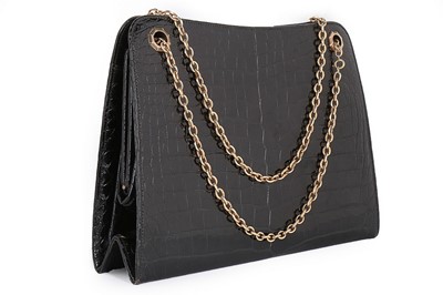 Lot 30 - A Cartier black crocodile handbag with 9ct...