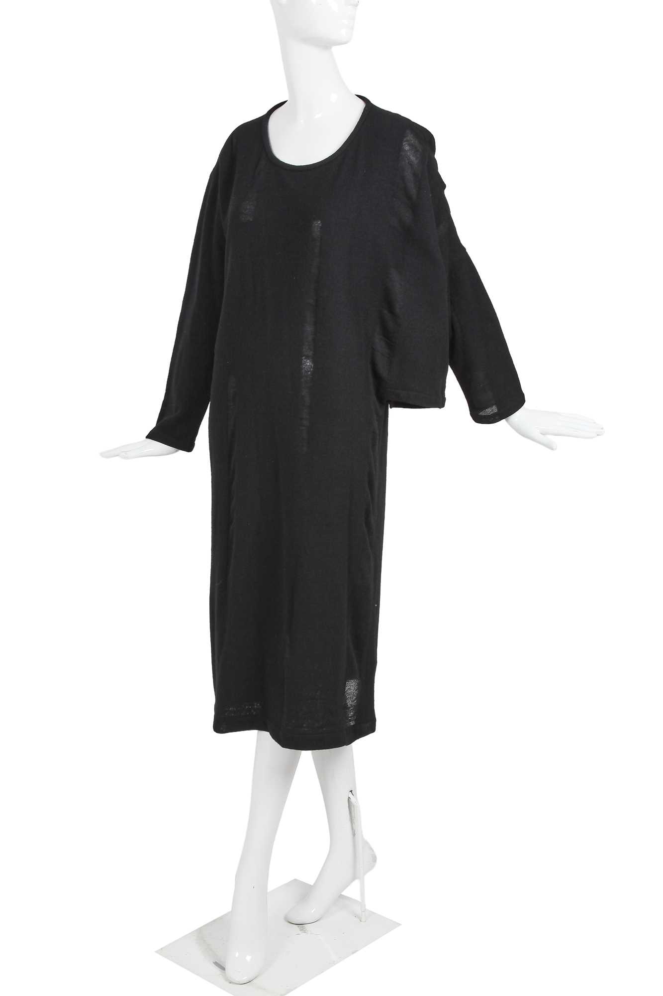 Lot 60 - An important Comme des Garçons distressed black wool dress, probably ‘Holes’ collection, Autumn-Winter 1982-83