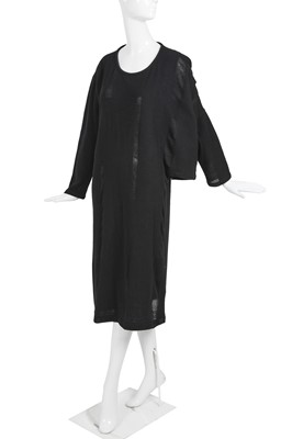 Lot 60 - An important Comme des Garçons distressed black wool dress, probably ‘Holes’ collection, Autumn-Winter 1982-83