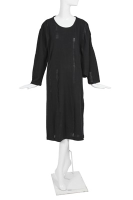Lot 60 - An important Comme des Garçons distressed black wool dress, probably ‘Holes’ collection, Autumn-Winter 1982-83