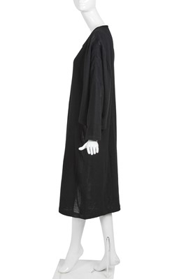 Lot 60 - An important Comme des Garçons distressed black wool dress, probably ‘Holes’ collection, Autumn-Winter 1982-83